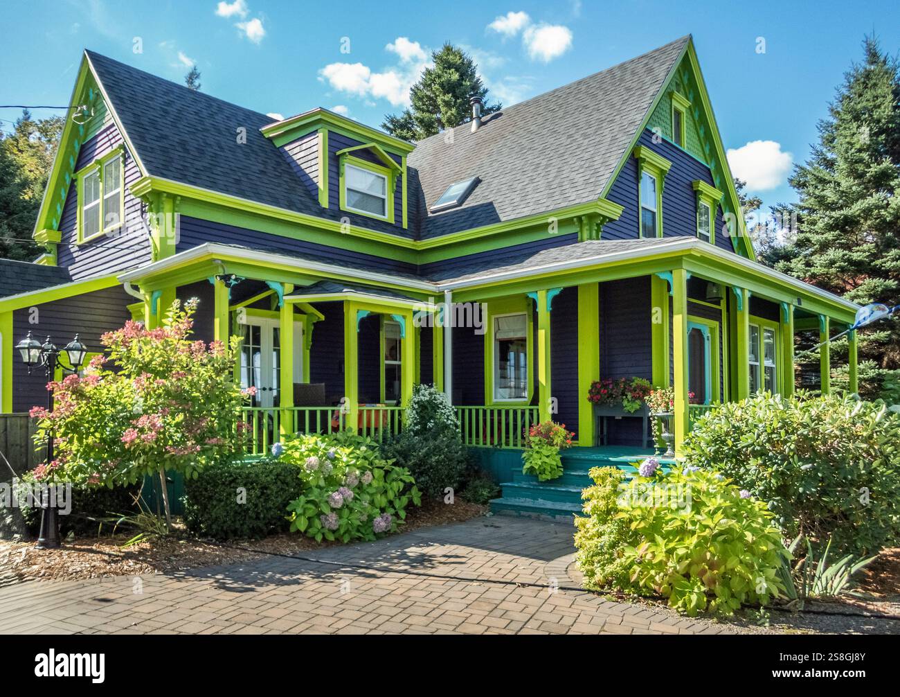 A colorful green house in LaHave on the South Shore of Nova Scotia Canada Stock Photo