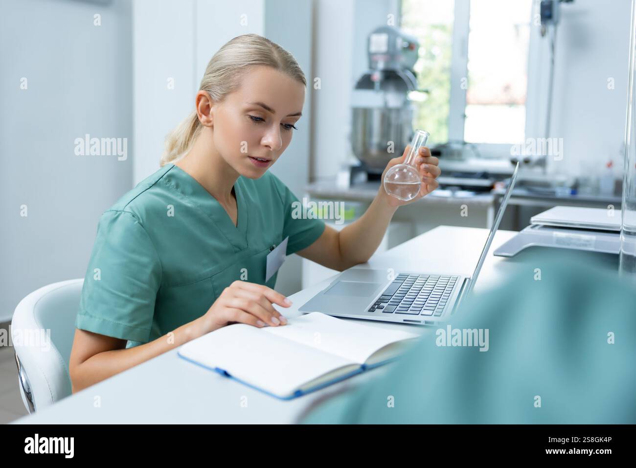 Docter Using Science Doctor in laboratory conducting scientific investigation on new ...
