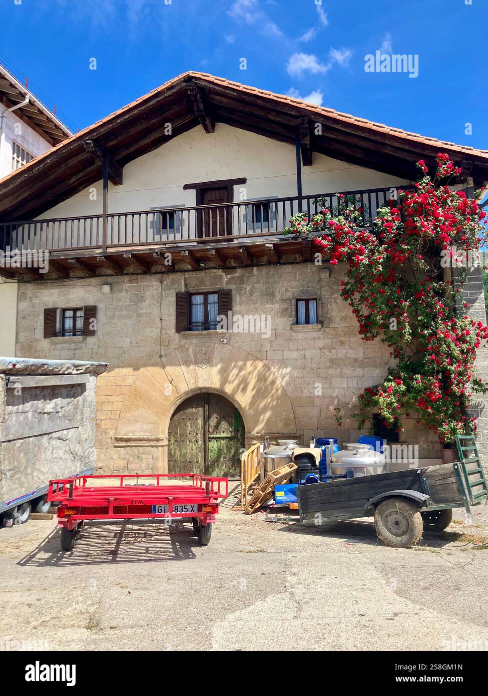 Traditional Farm and House with Agricultural Equipment: Seen from the Camino Francés in Navarre, Northern Spain - Smartphone Captured Stock Image