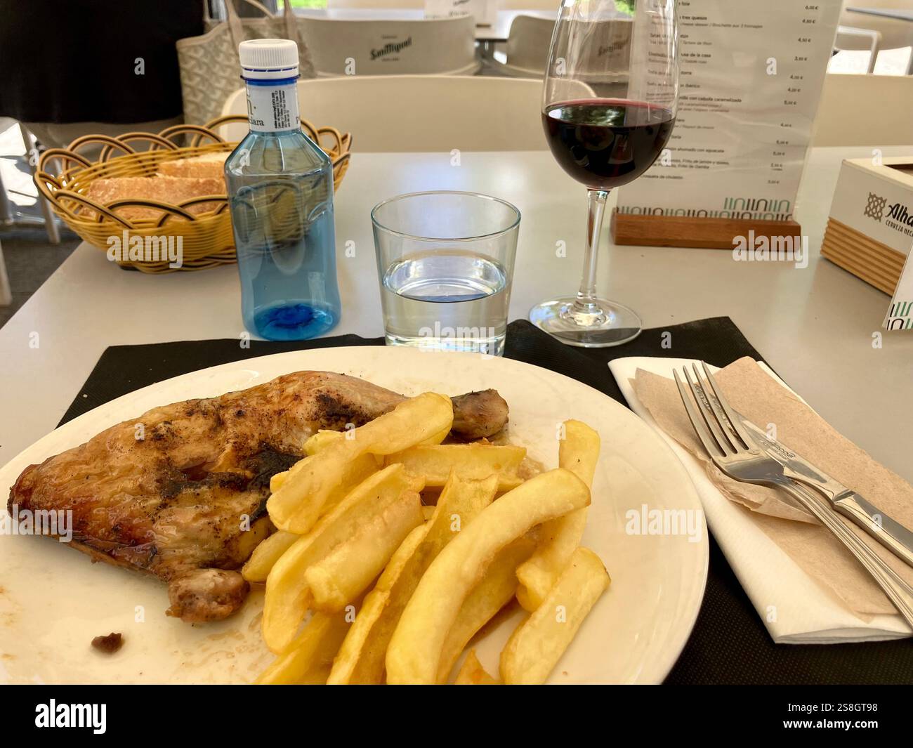 Steak, Fries, Red Wine, Water and Bread: A Typical Meal on the Camino Francés - Smartphone Captured Stock Image