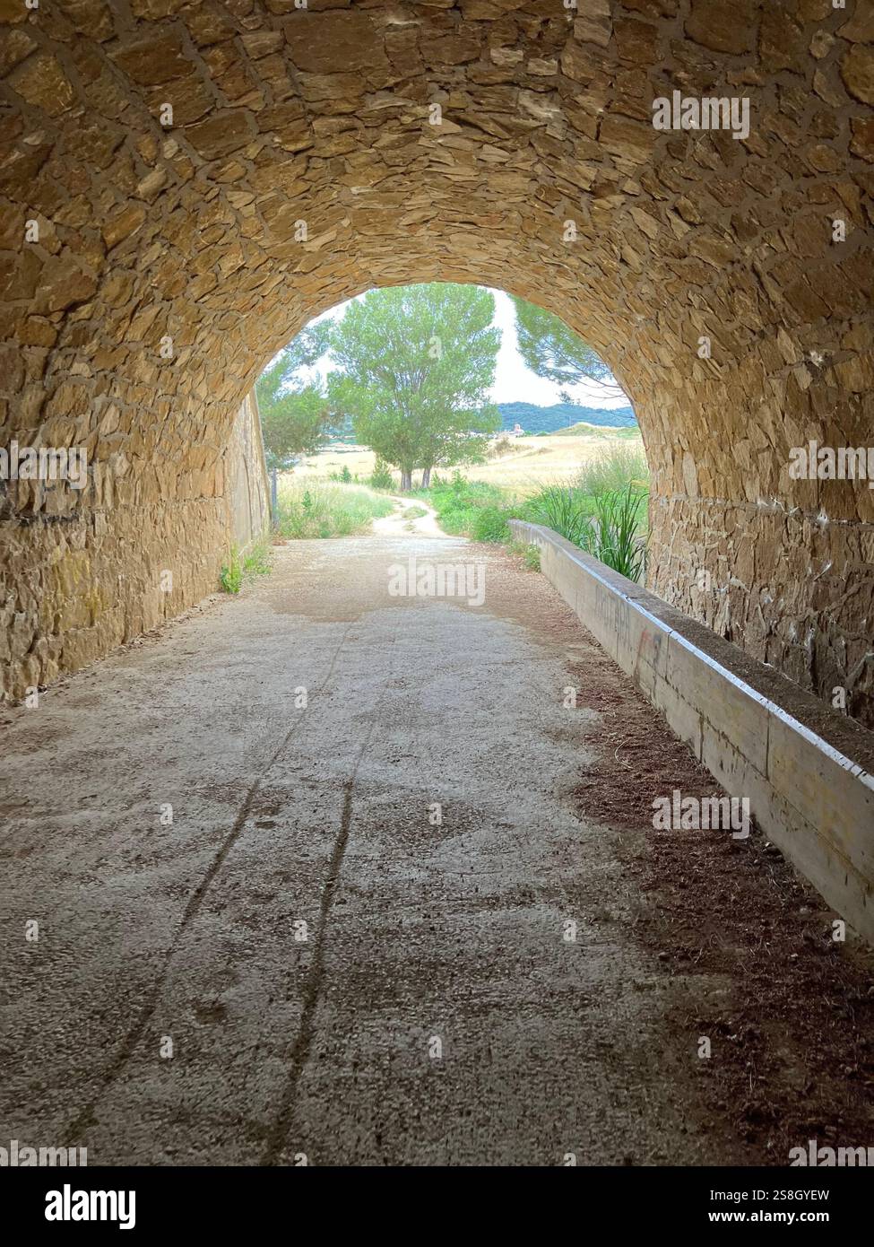 Tunnel under the Road. Walking into Villatuerta, Navarre, Spain on the Camino Francés - Smartphone Captured Stock Image