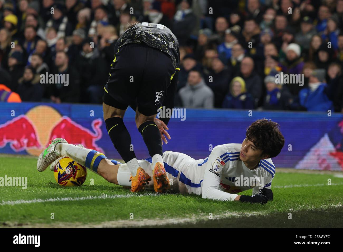 Ao Tanaka (Leeds United) is floored during the Sky Bet Championship