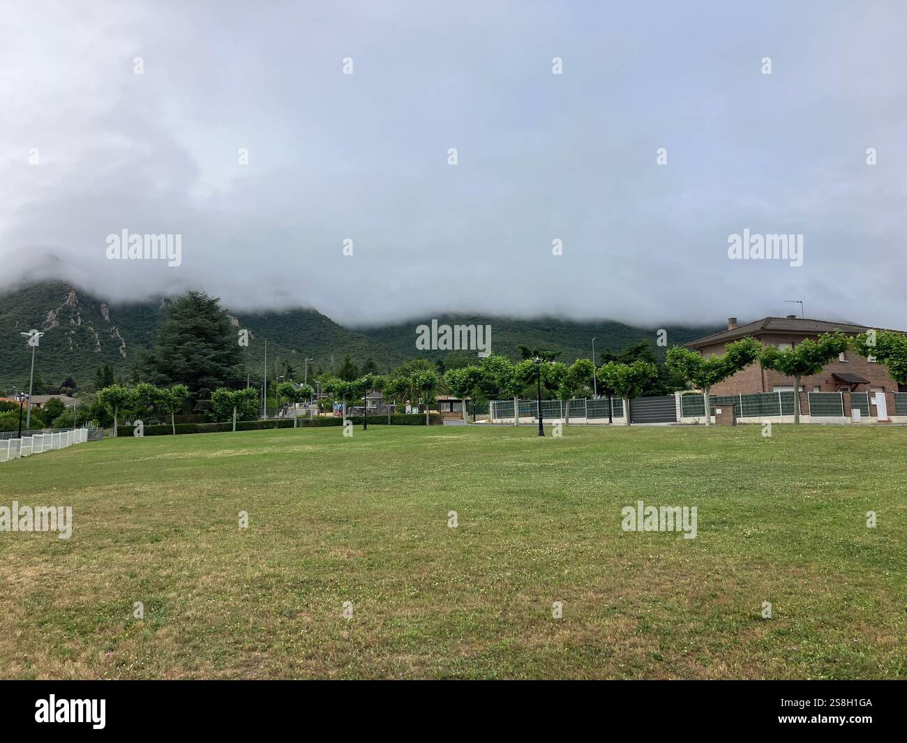 Small Village of Irache with Cloud Topped Hills in the Background: Navarre, Spain - Smartphone Captured Stock Image