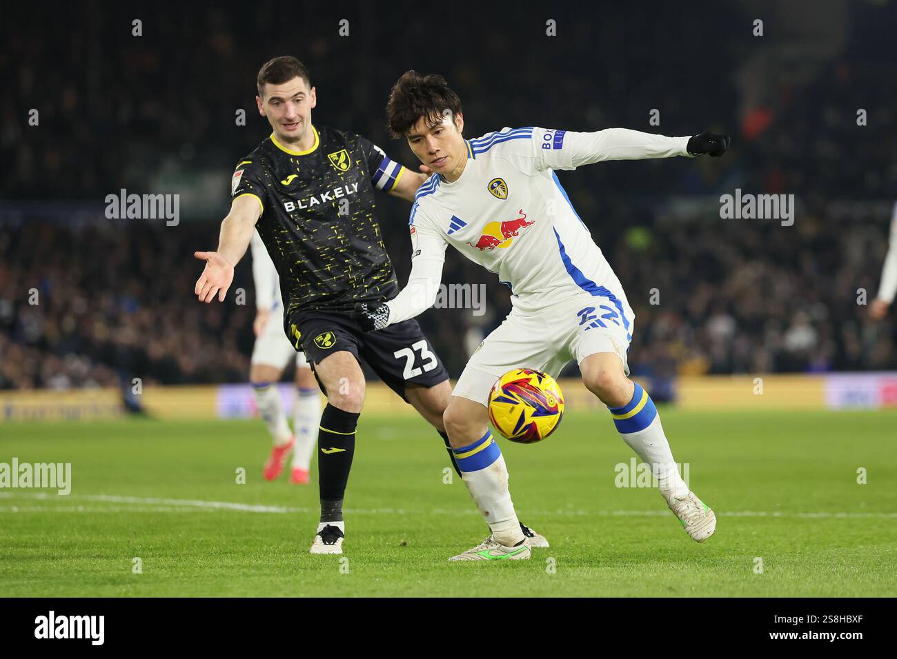 Ao Tanaka (Leeds United) is marked by Kenny McLean (Norwich City