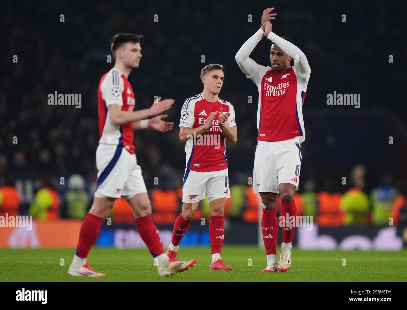 Arsenal's Leandro Trossard (centre) and Gabriel after the UEFA