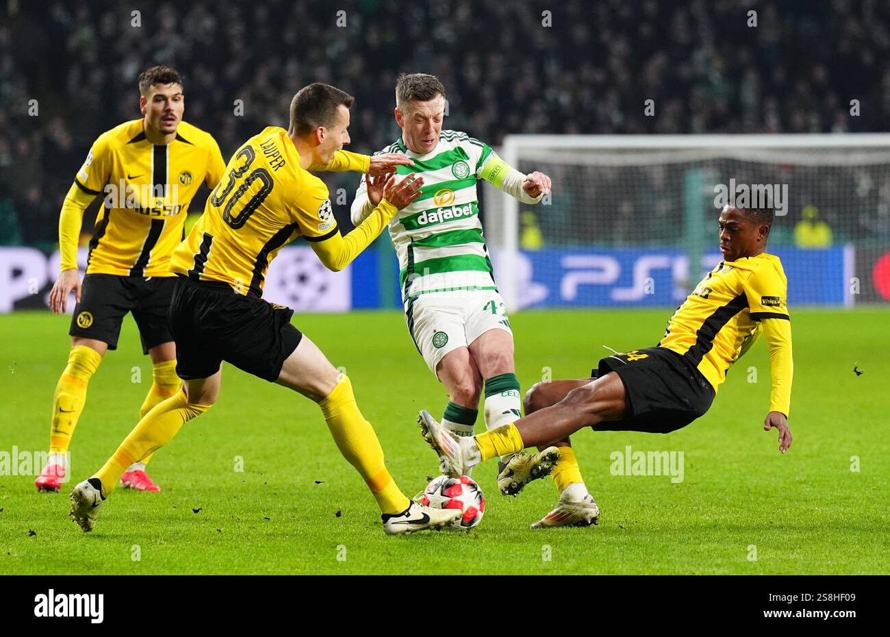 Celtic's Callum McGregor (centre) battles with Young Boys' Miguel