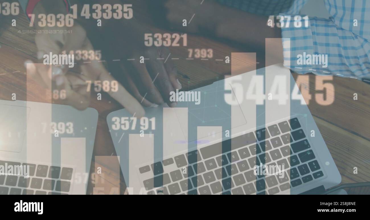 Image of graph and data processing over hands of diverse colleagues using laptops Stock Photo