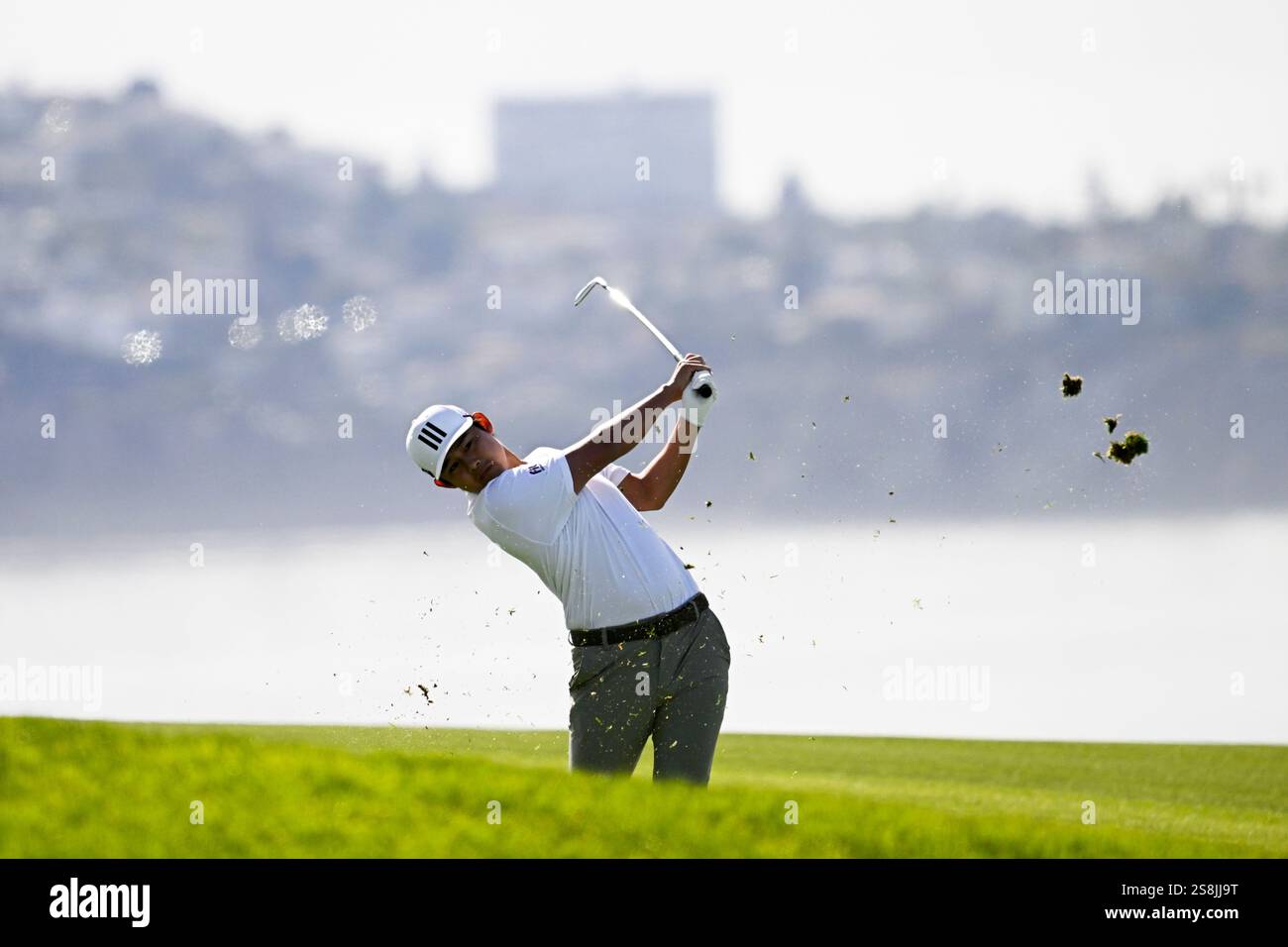 Kaito Onishi hits out of the rough on the fourth hole of the South