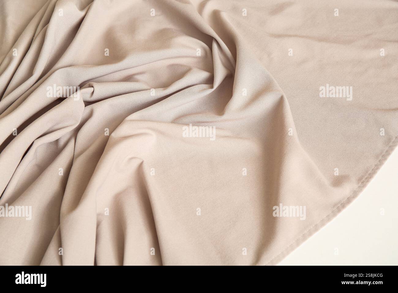 Beige tablecloth with folds on table, closeup Stock Photo