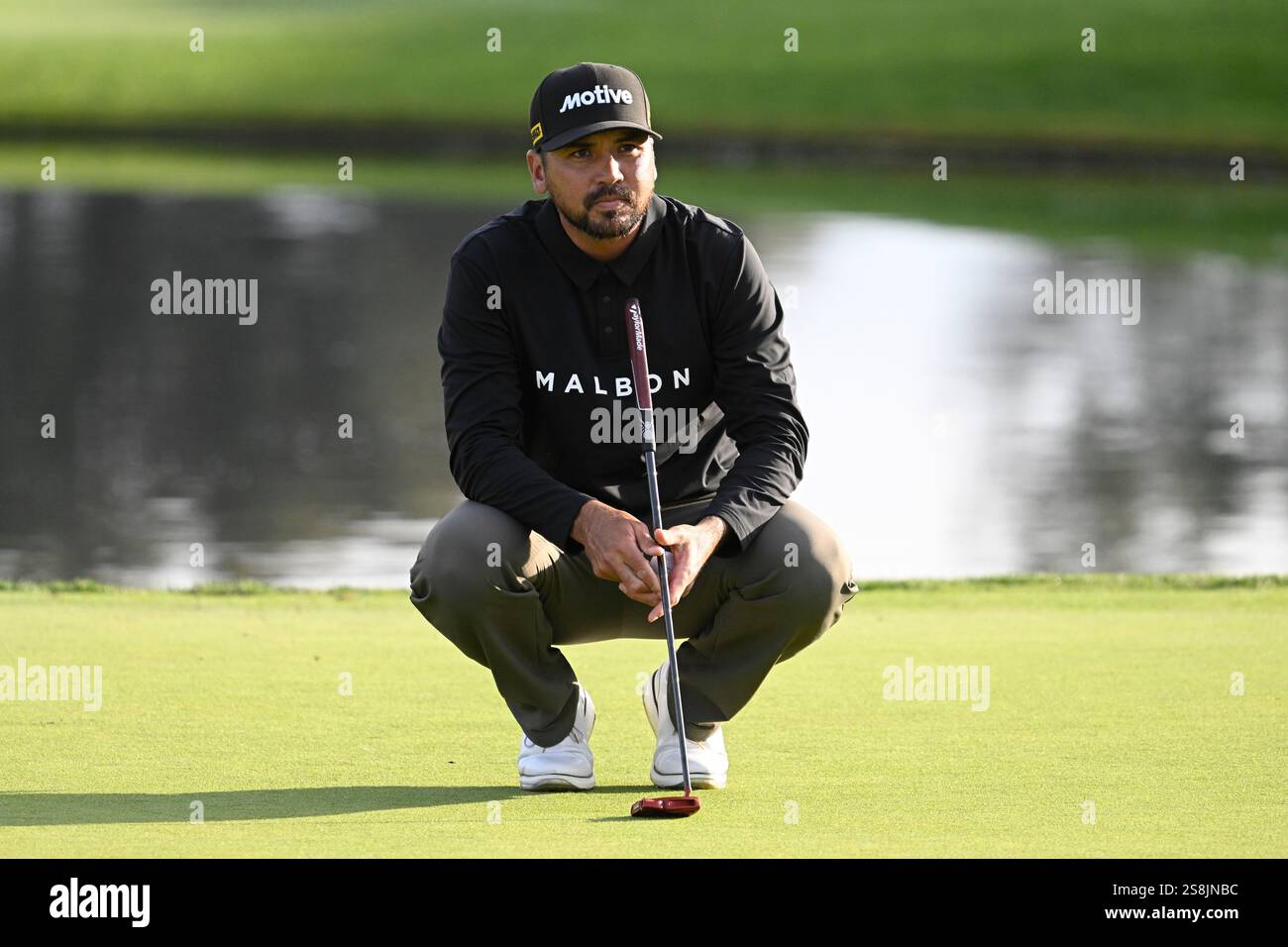 Jason Day lines up a putt on the 18th hole of the South Course at