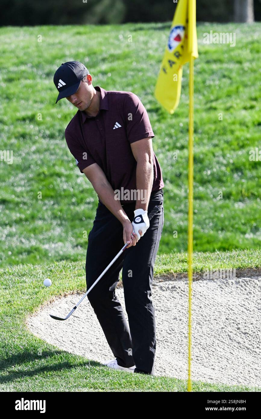 Ludvig Aberg hits a chip shot on the eighth hole of the North Course at