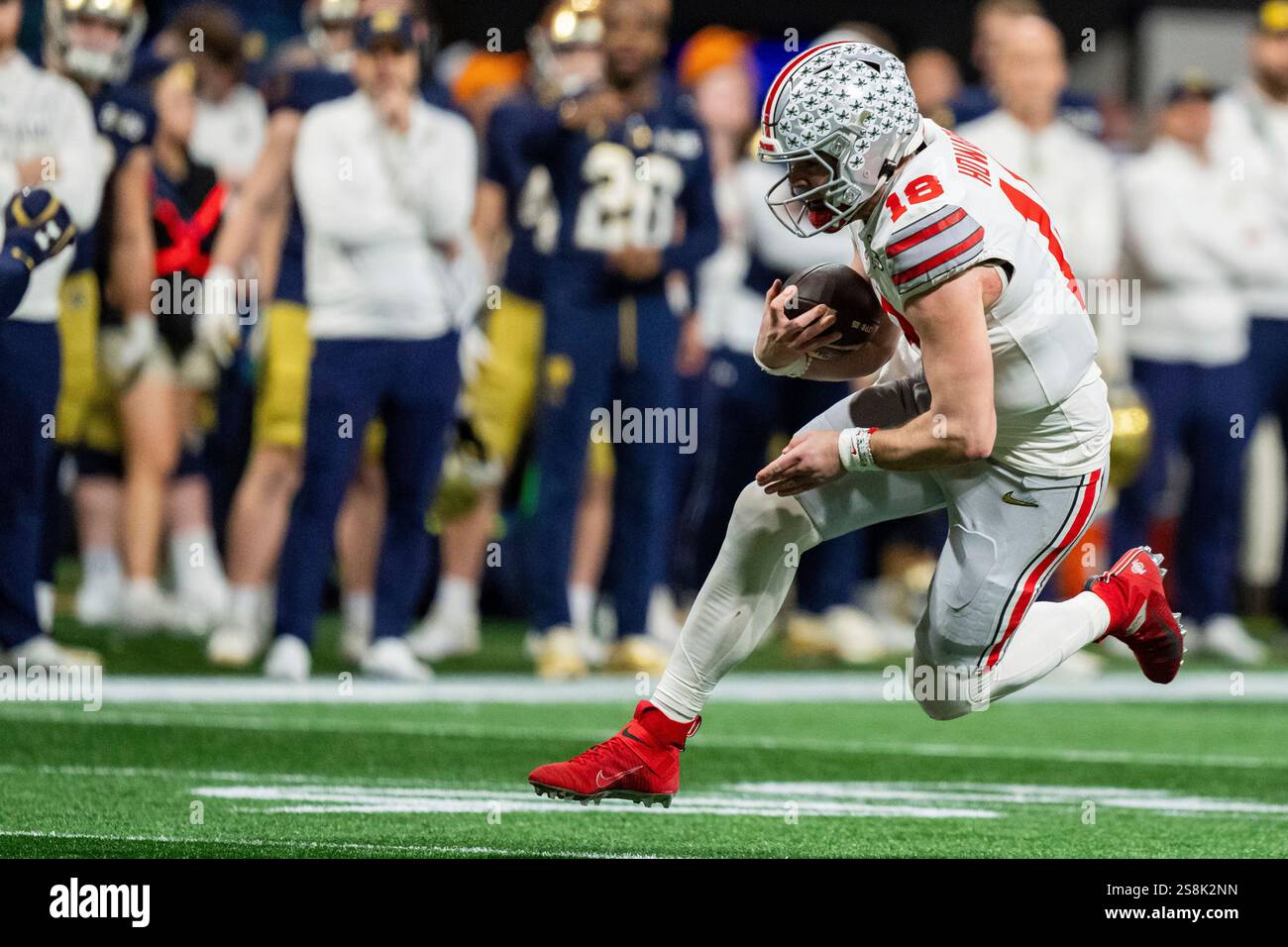 Ohio State quarterback Will Howard (18) runs with the ball during the