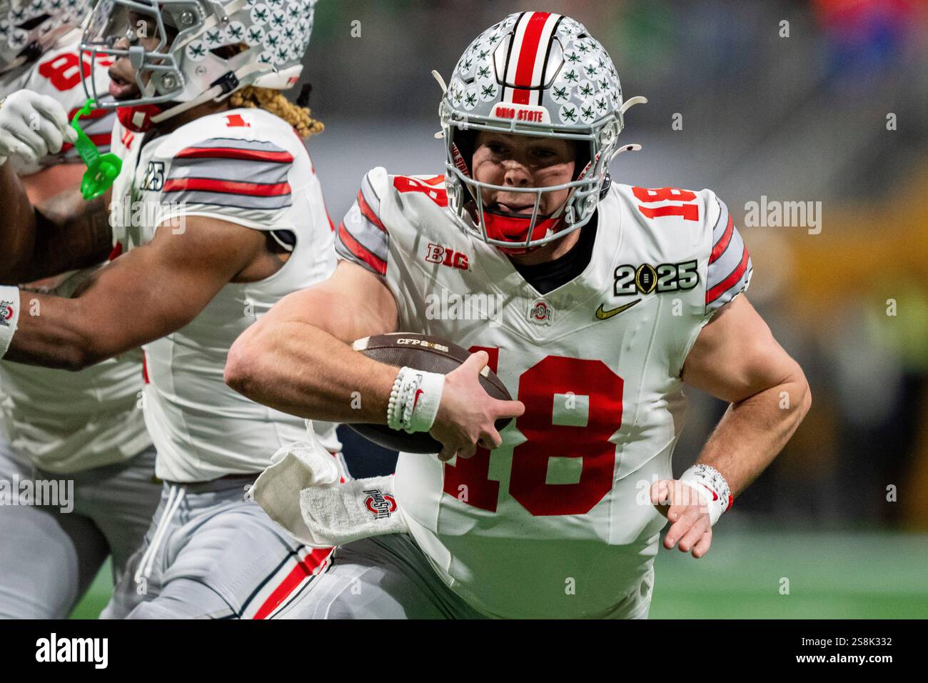 Ohio State quarterback Will Howard (18) runs with the ball during the