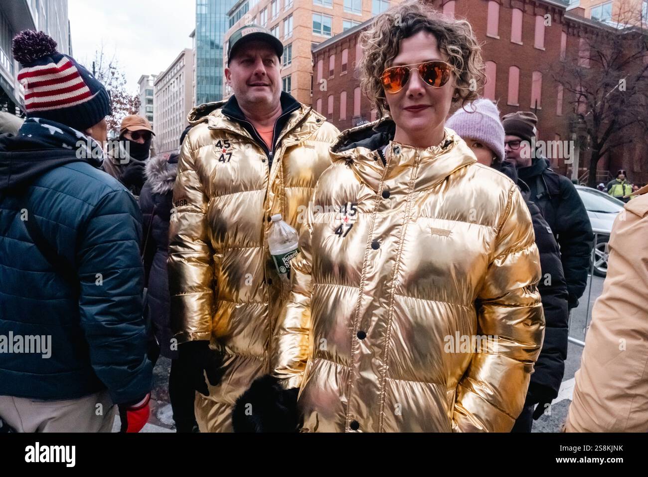 Gold puffer coats hi-res stock photography and images - Alamy