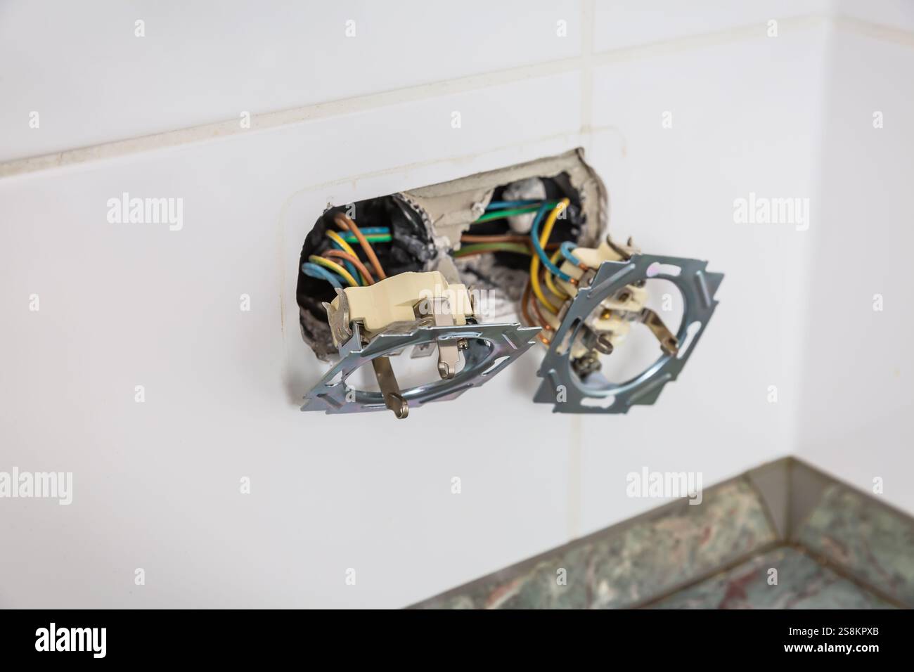 Fixing and repairing broken outlets and socket with tools and ammeter Stock Photo