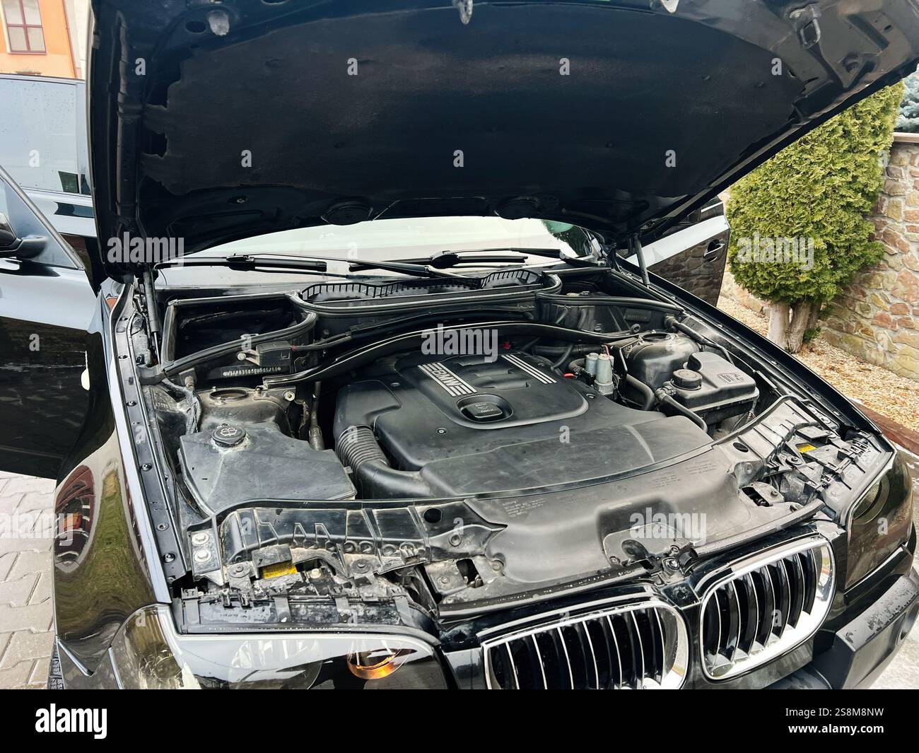 Kyiv, Ukraine - January 22, 2025: An open BMW X3 vehicle hood revealing ...
