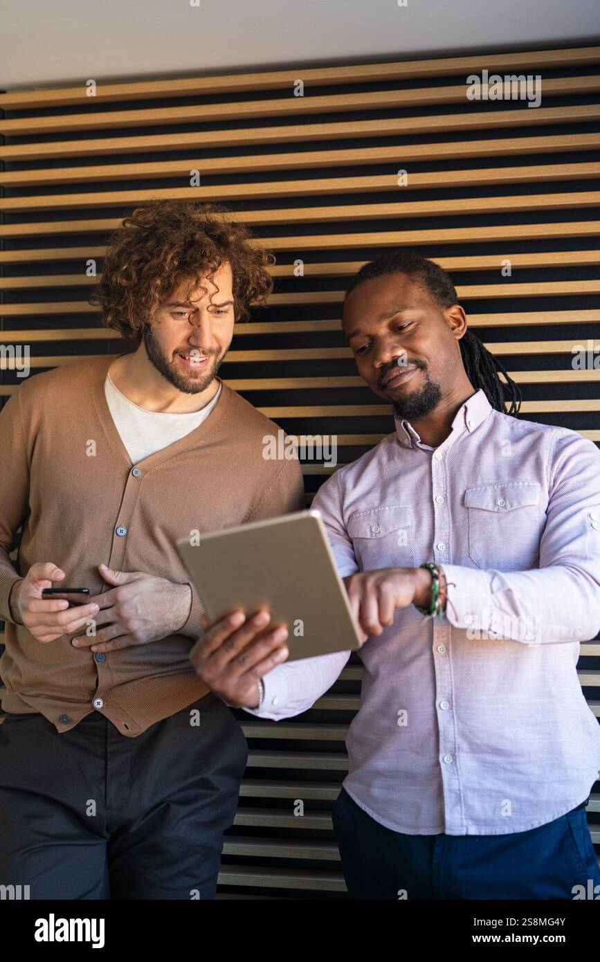 Multiethnic professional business people, programmer working in office with computer Stock Photo