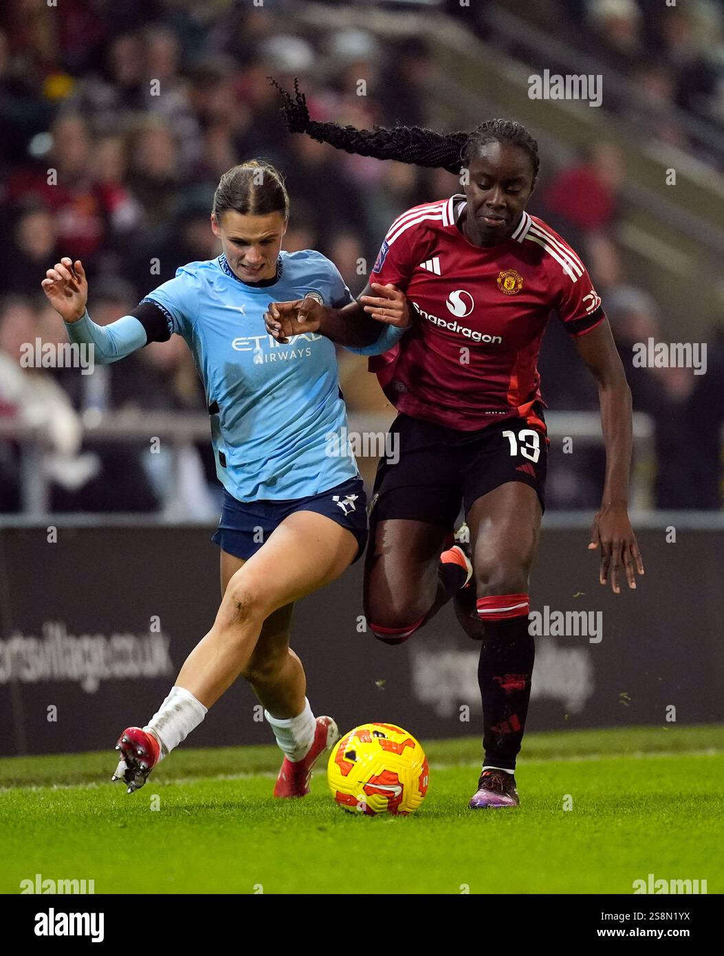 Manchester City's Kerstin Casparij and Manchester United's Simi Awujo
