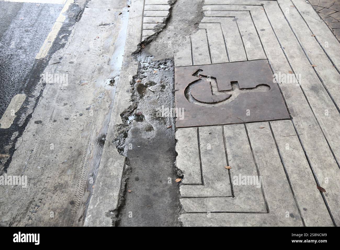 Damaged sidewalk wheelchair ramp in Manila city, Philippines. Dangerous ...
