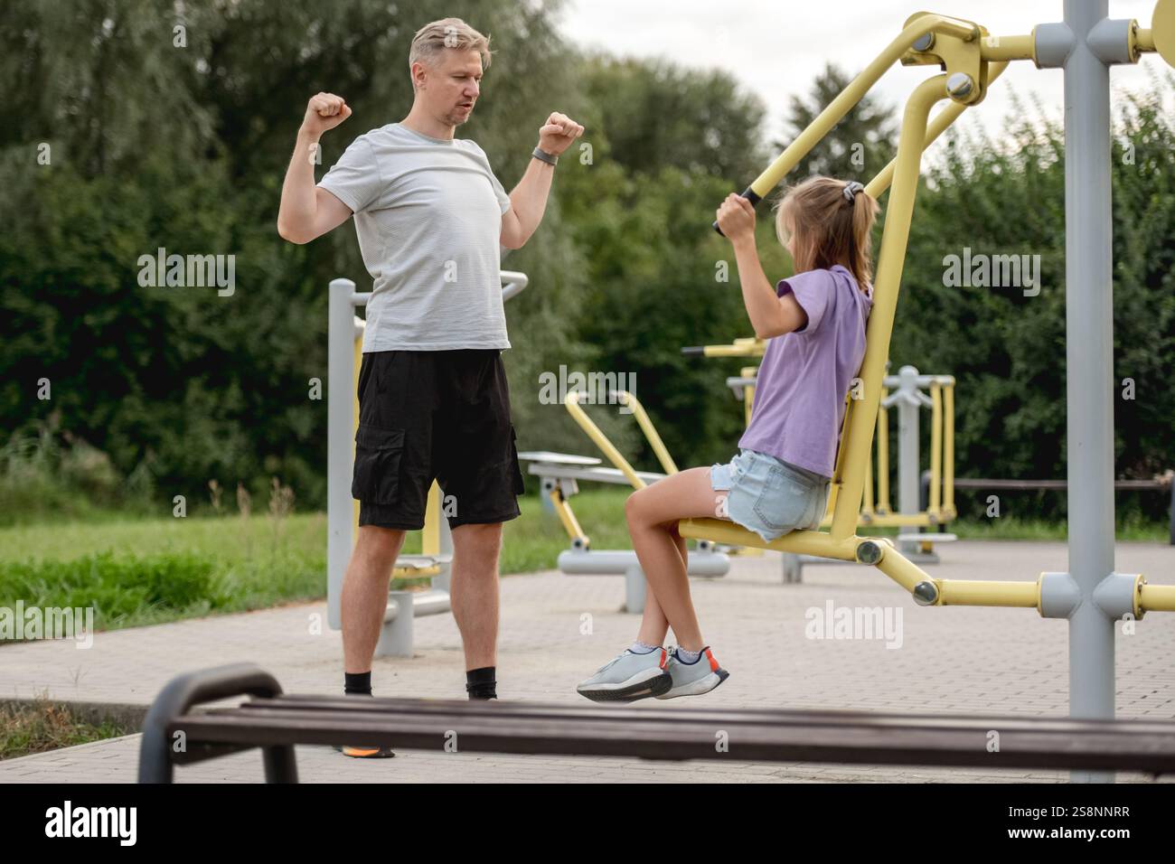 Father And Daughter Training Together At The Playground, Bonding ...