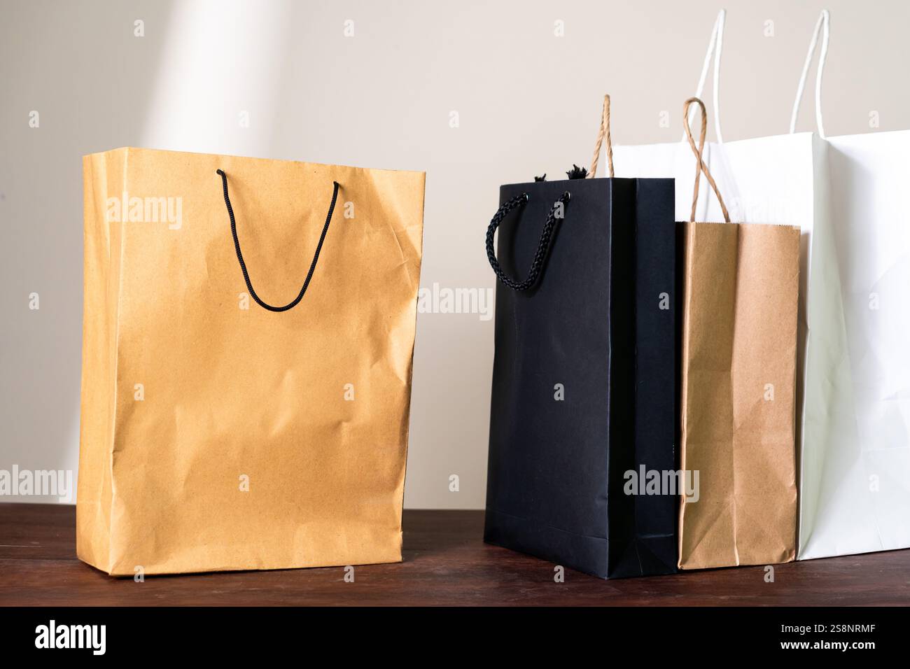 A collection of shopping bags in various colors including brown, black ...