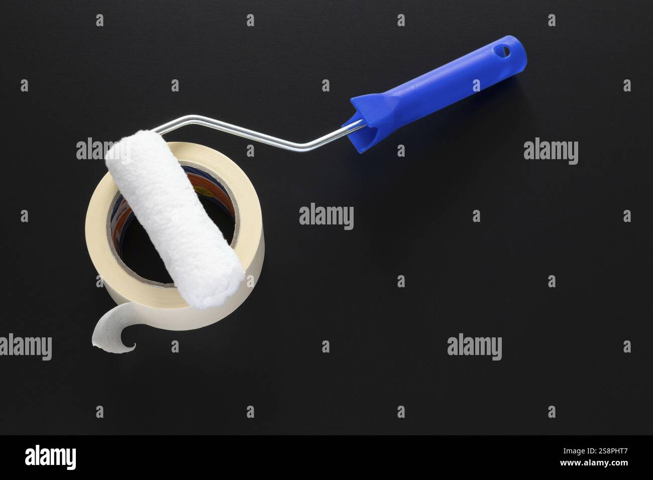 A typical painting roller isolated on black background Stock Photo