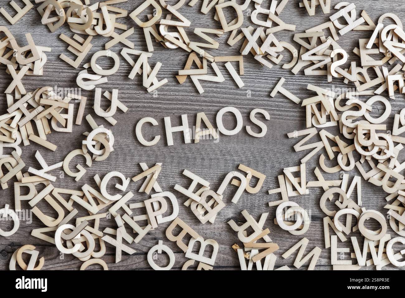 An image of some wooden letters and the word chaos Stock Photo - Alamy