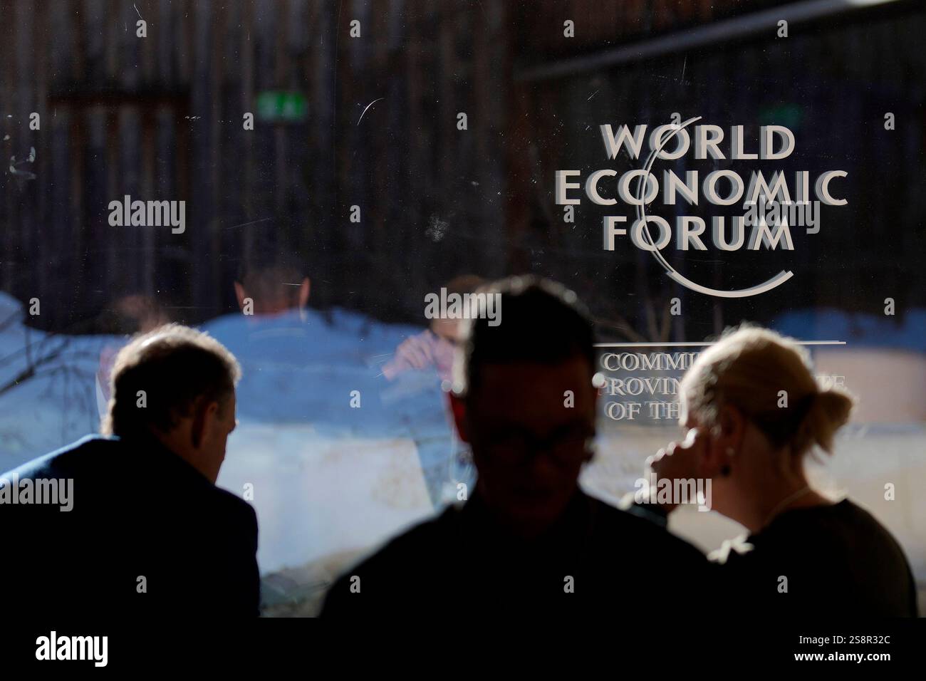 The logo of the World Economic Forum is displayed on a window at the ...