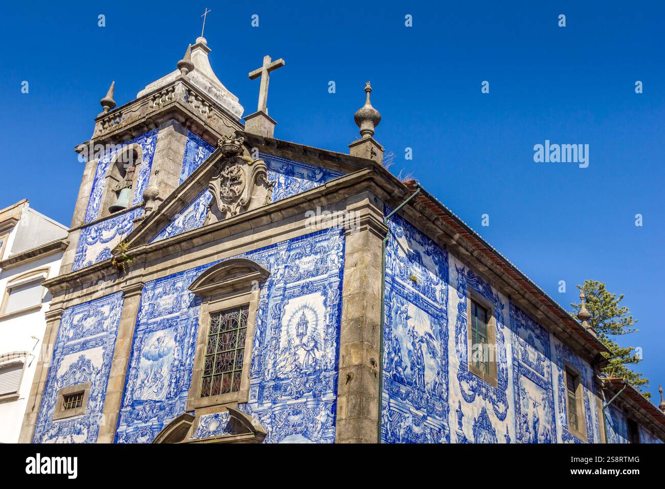 Porto, Portugal - 11 August, 2023: View of the facade of the Chapel of the Souls. It is one of the most photographed churches in Porto due to its magn Stock Photo