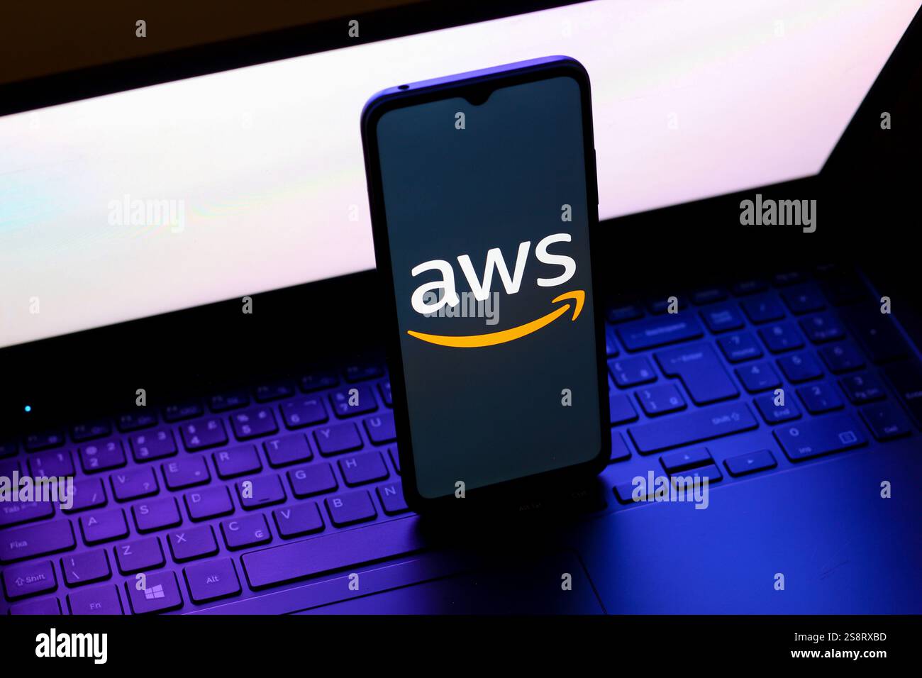 In this photo illustration, the Amazon Web Services (AWS) logo is seen displayed on a smartphone screen. Stock Photo
