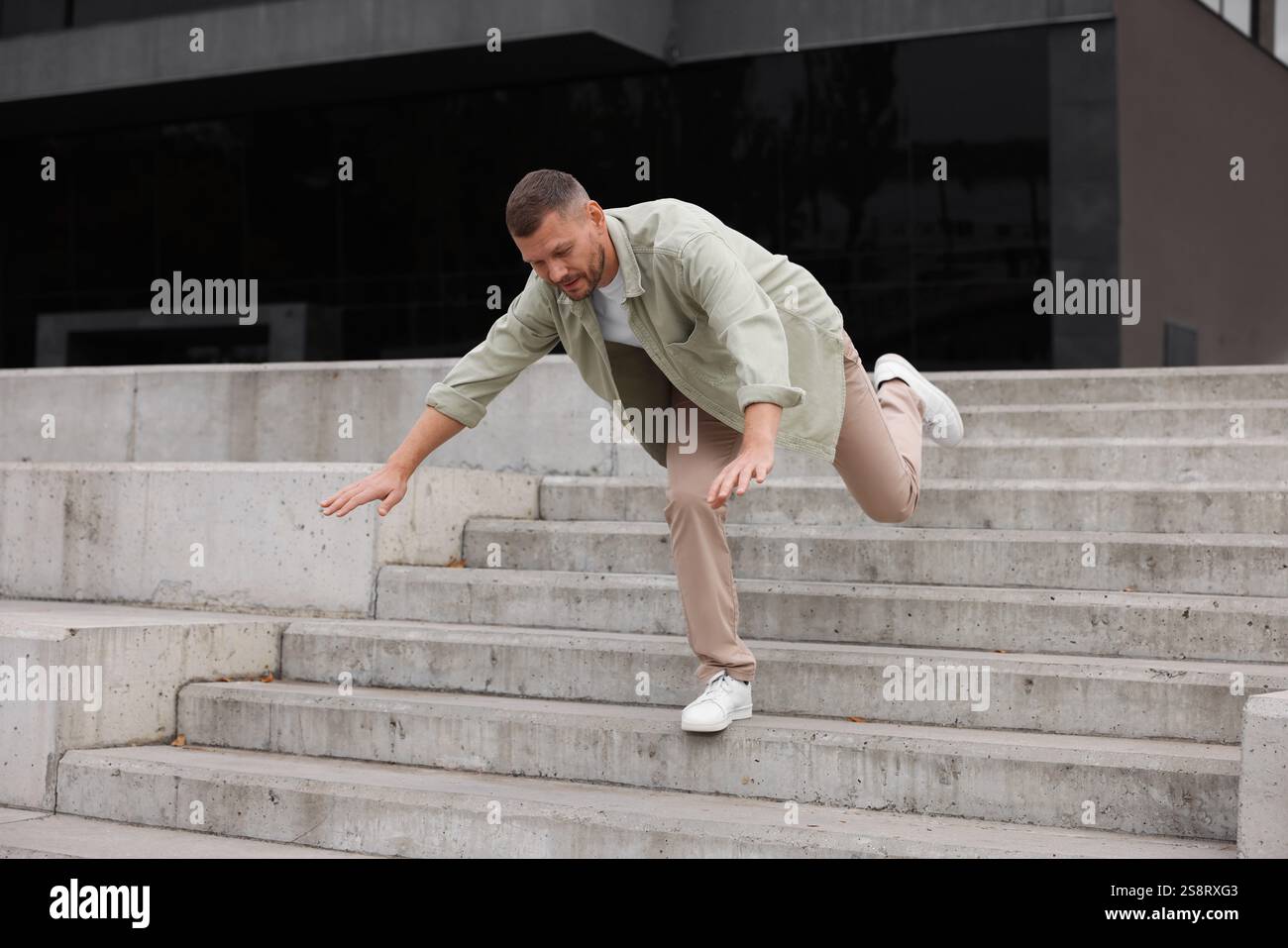 Man falling on stairs outdoors. Dangerous accident Stock Photo - Alamy