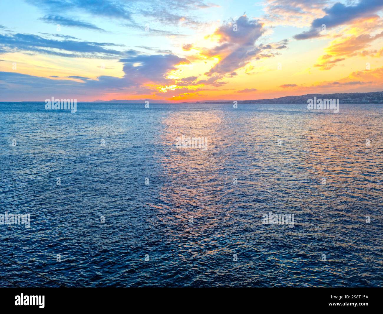 Sunset and clouds over the ocean Stock Photo