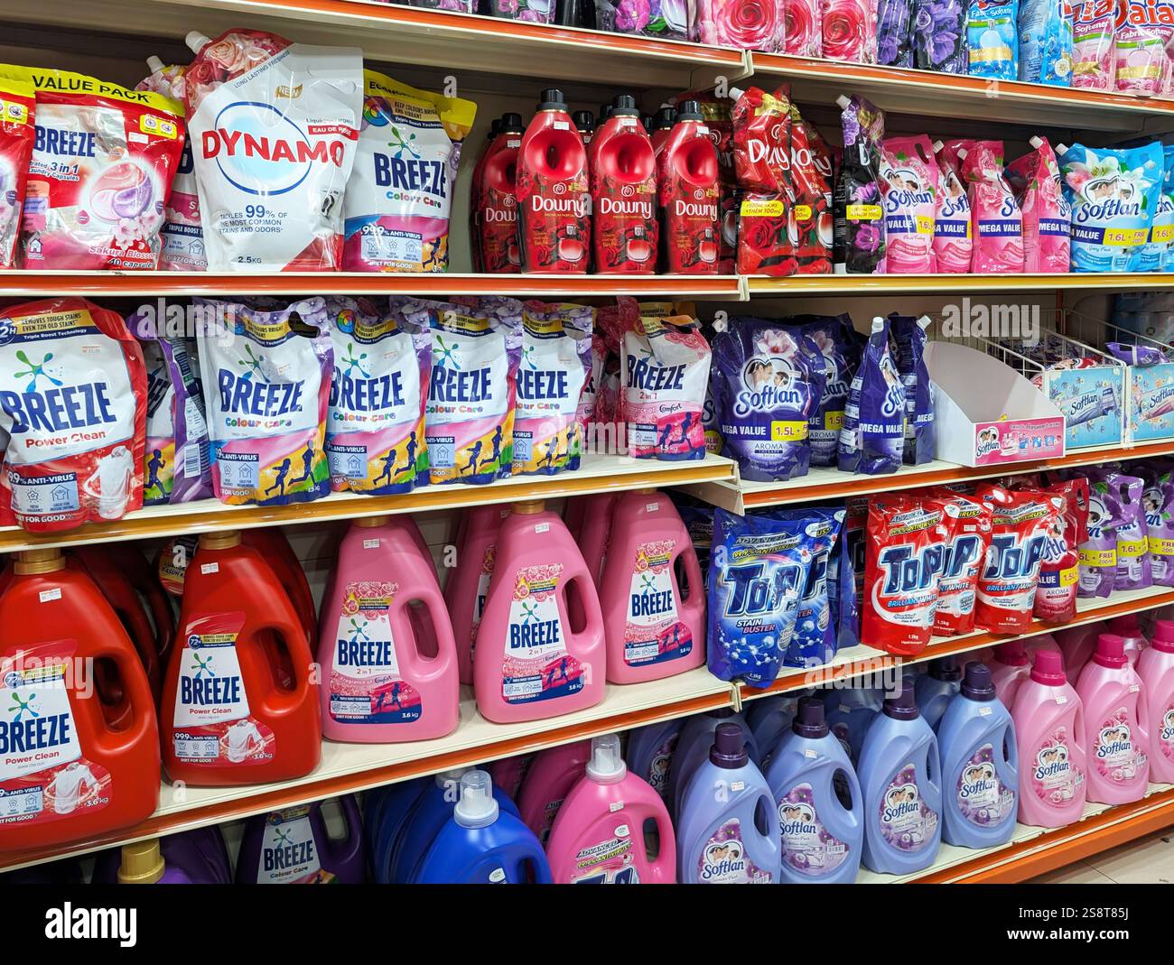 Kota Kinabalu, Malaysia - Jan 20, 2025: Various type and brand of dishwasher and laundry detergent displayed for sale on shelves - Smartphone Captured Stock Image