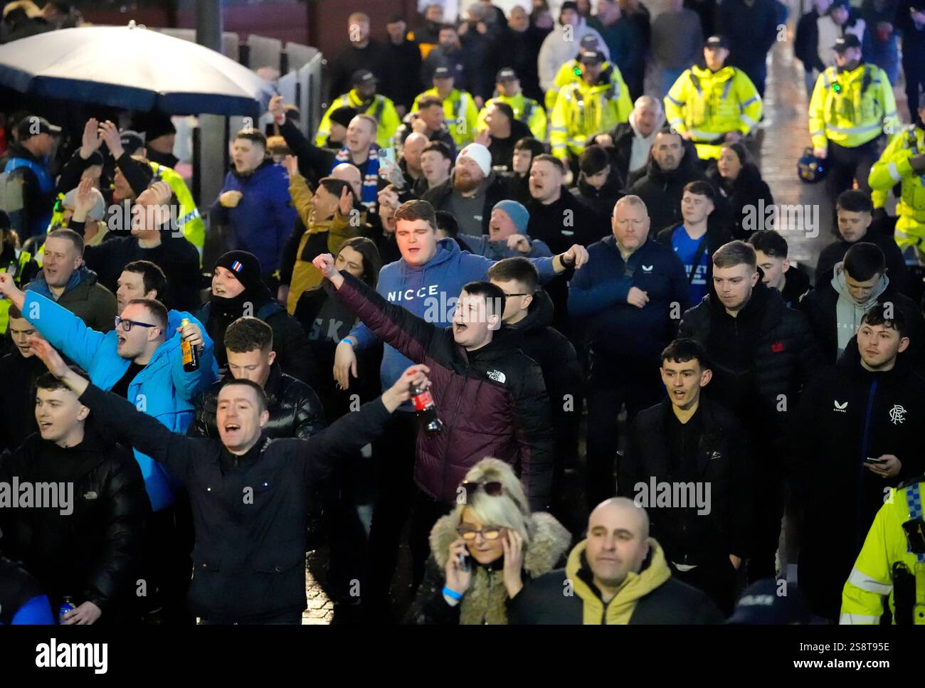 Rangers fans escorted by police in Manchester, ahead of their team's