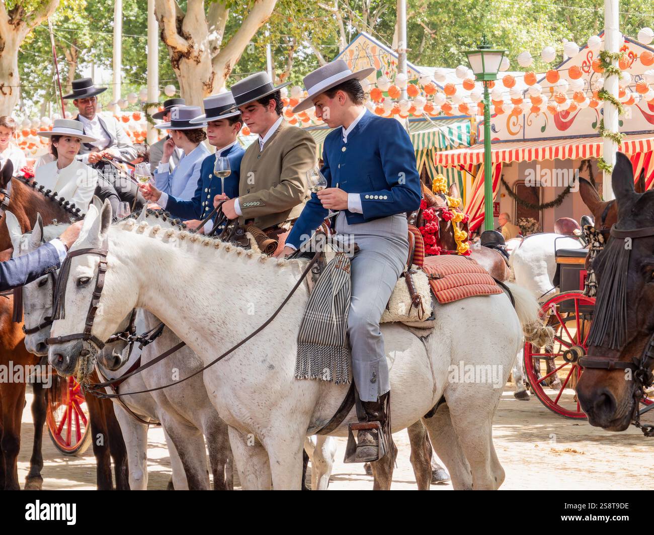 Spanish Riding Hats Group of Spanish riders in traditional attire on horseback at an ...