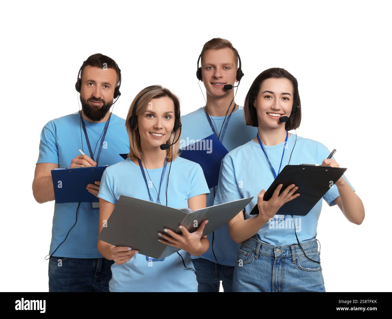 Technical support call center. Team of friendly operators working on ...