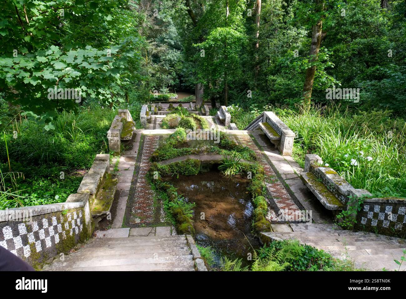 Luso, Portugal. Ancient Bussaco Forest, UNESCO designated. Ancient walled forest with fountains and religious markers. Stock Photo