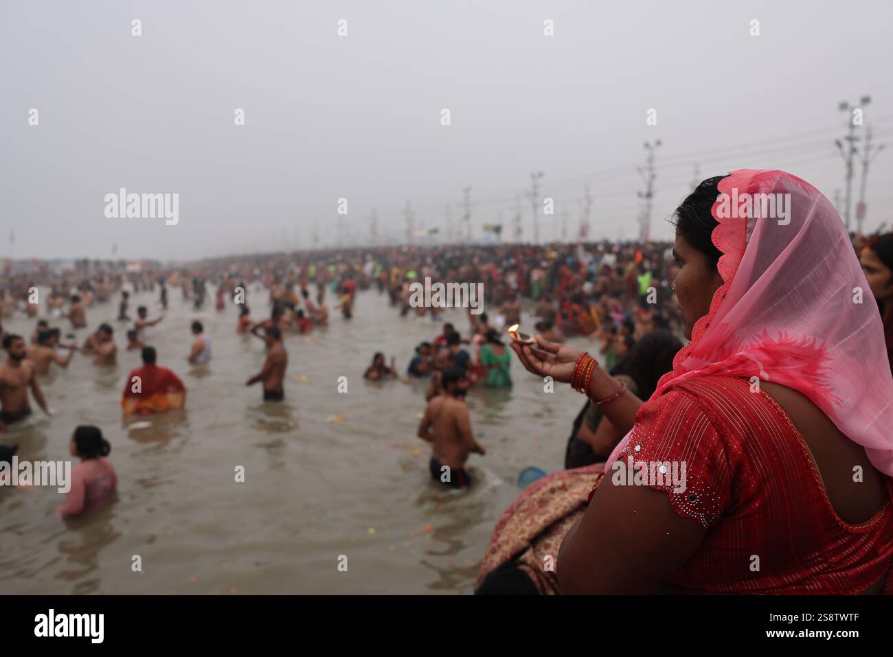 Pilgrims bathing in the Ganges at the Triveni Sangam on the auspicious ...