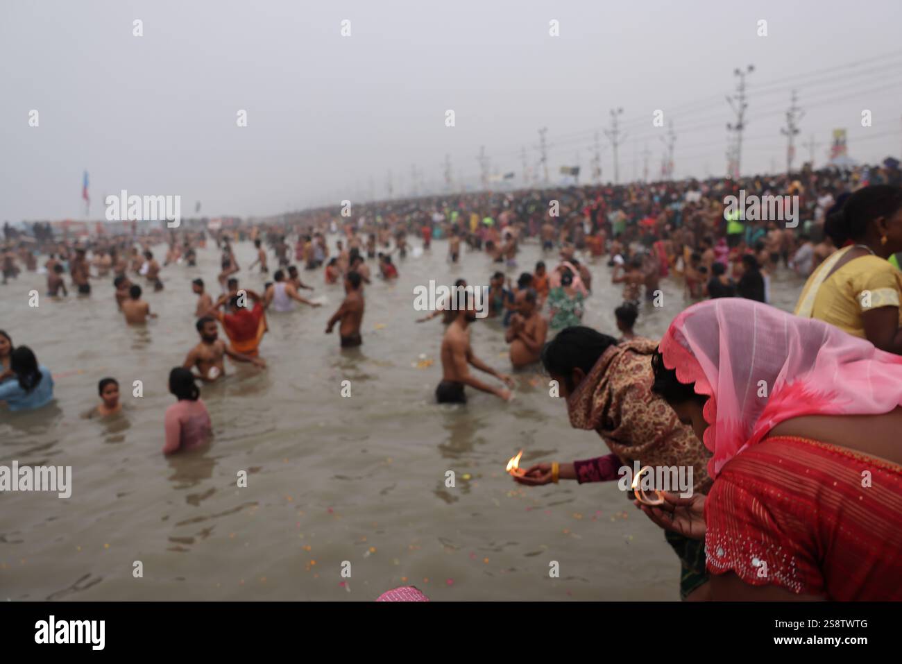 Pilgrims bathing in the Ganges at the Triveni Sangam on the auspicious ...