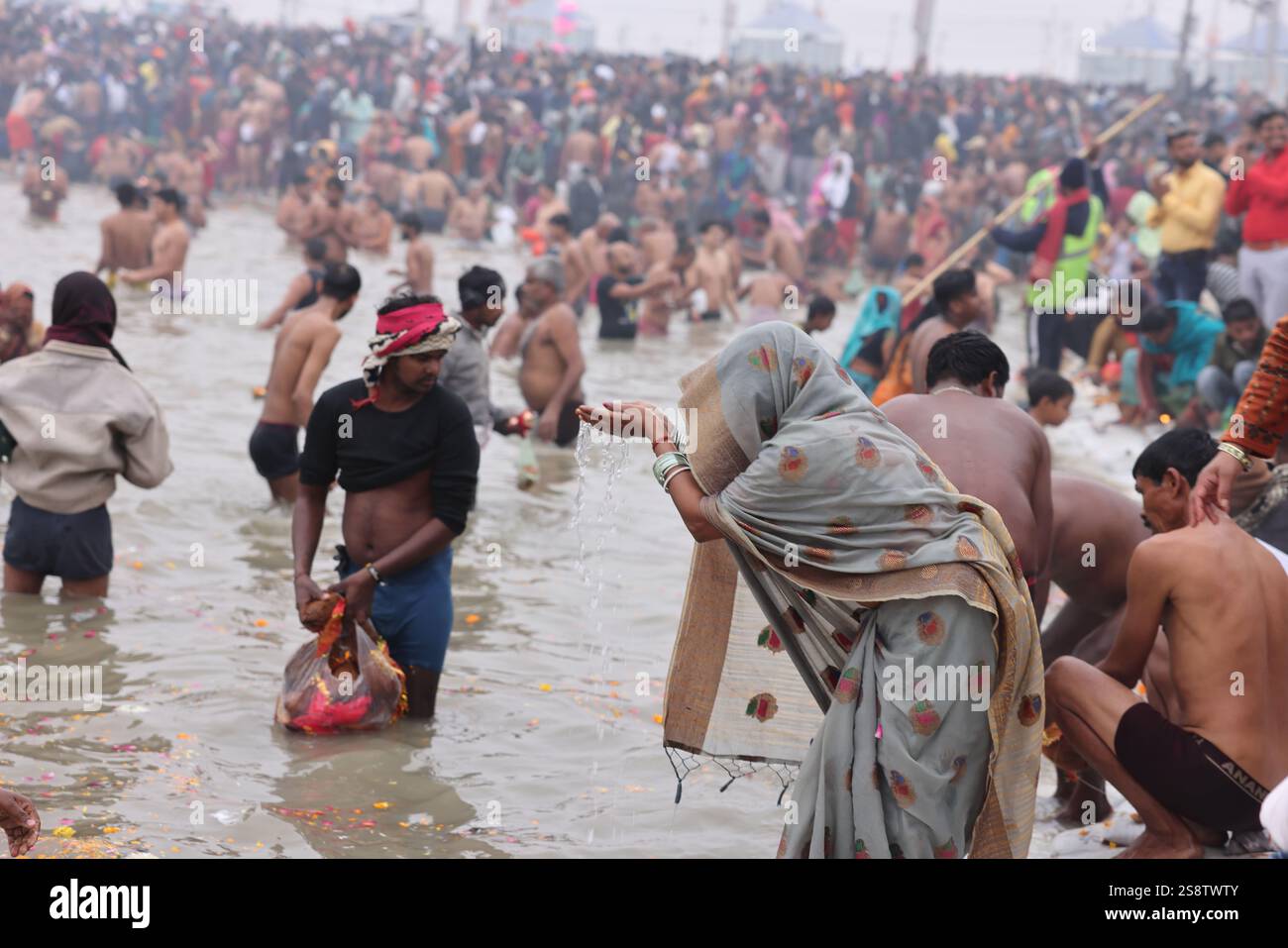 Pilgrims bathing in the Ganges at the Triveni Sangam on the auspicious ...