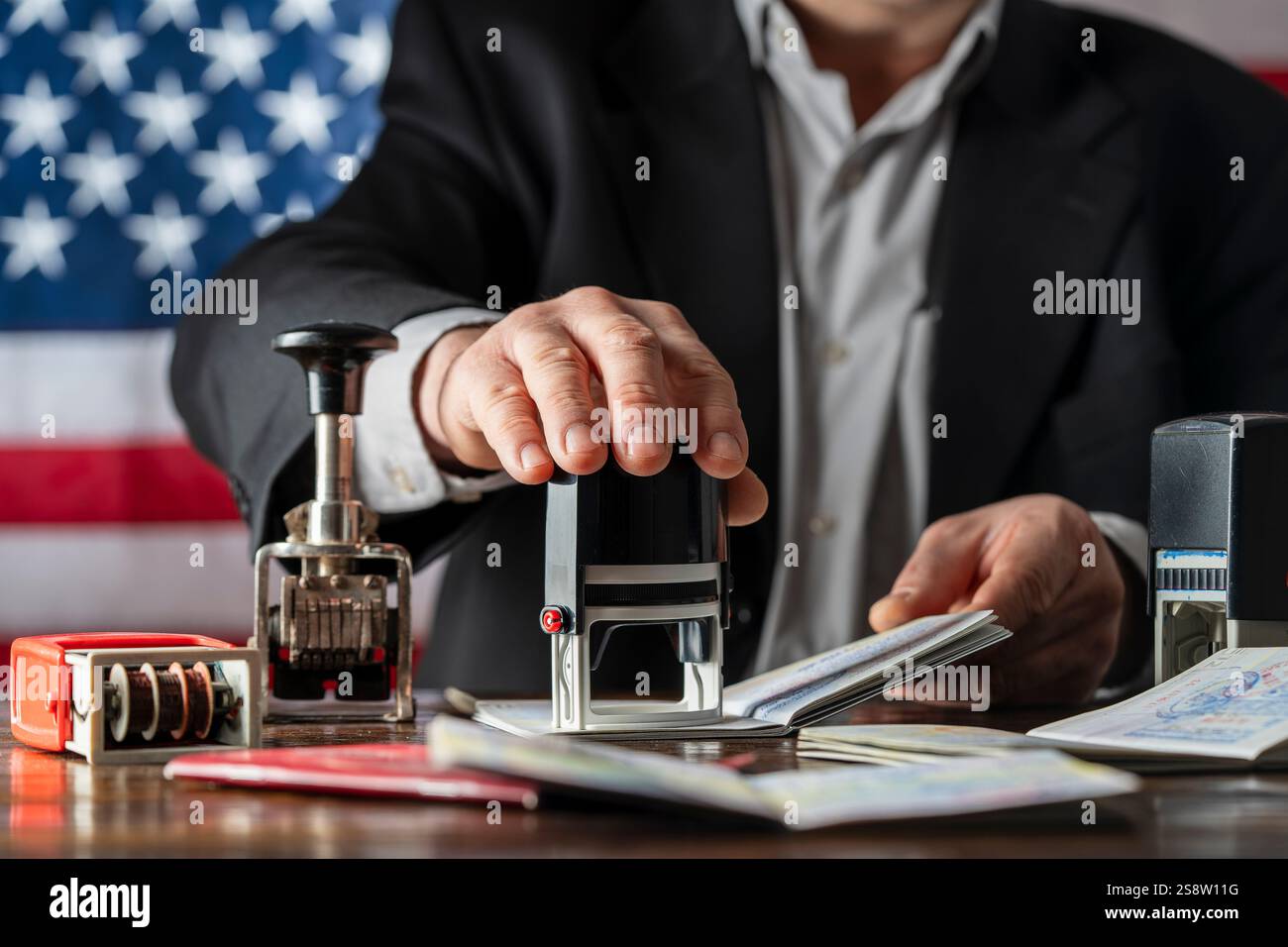 Immigration Control Background Immigration and passport control on the American flag background, close ...