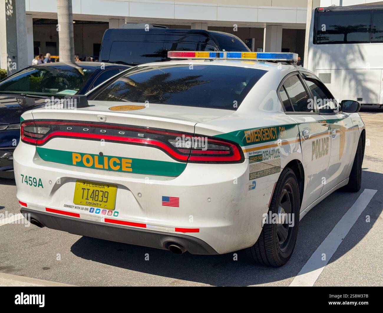 Miami, Florida, USA - 4 January 2024: Rear view of a patrol care of the Miami-Dade Police Department parked in the Port of Miami - Smartphone Captured Stock Image