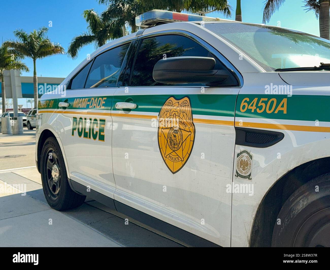 Miami, Florida, USA - 4 January 2024: Close up view of a patrol car of the Miami-Dade Police Department parked in the Port of Mia - Smartphone Captured Stock Image