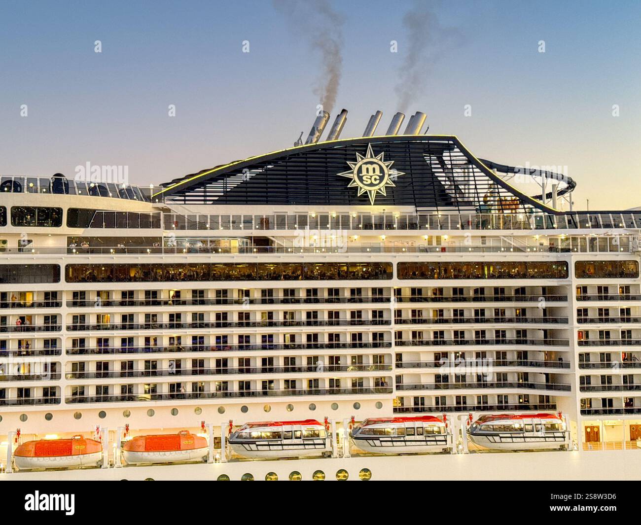 Miami, Florida, USA - 4 January 2025: Logo sign on the funnel of a cruise ship operated by MSC Cruises. - Smartphone Captured Stock Image Miami, Florida, USA - 4 January 2025: Logo sign on the funnel of a cruise ship operated by MSC Cruises. - Smartphone Captured Stock Image