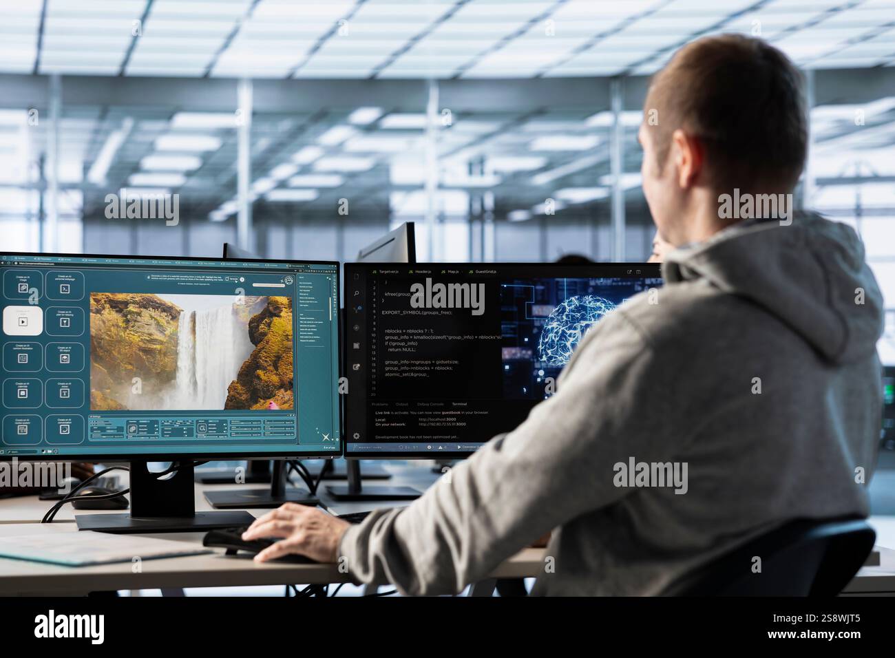 Computer scientist in server farm making generative artificial intelligence website generating videos using diffusion model algorithms. IT expert in office coding AI virtual assistant producing clips Stock Photo