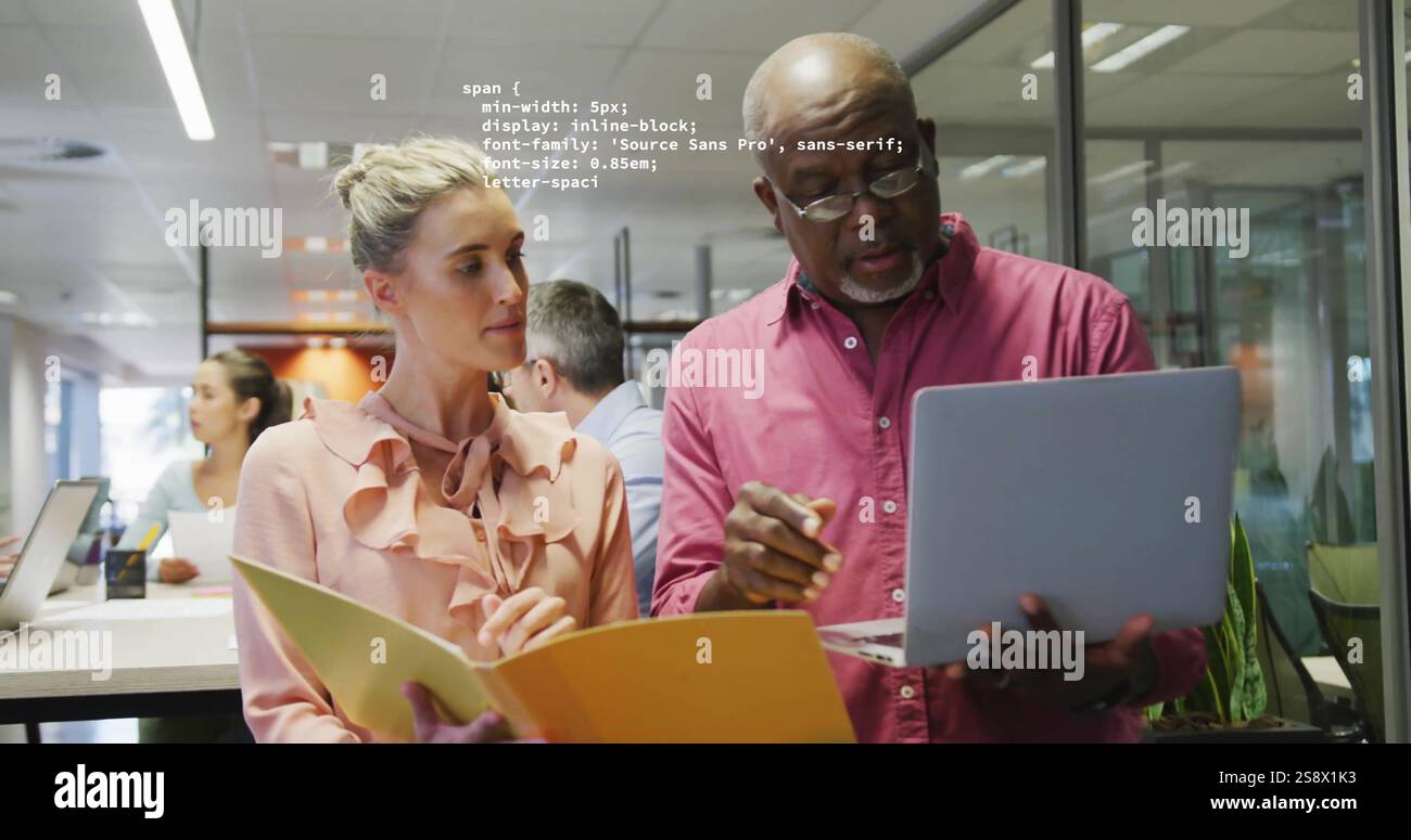 Image of data processing over diverse colleagues working in creative office Stock Photo