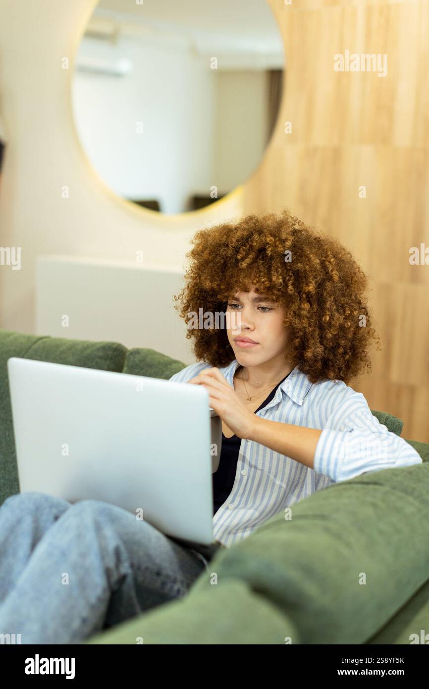 Woman seated comfortably on plush hi-res stock photography and images ...