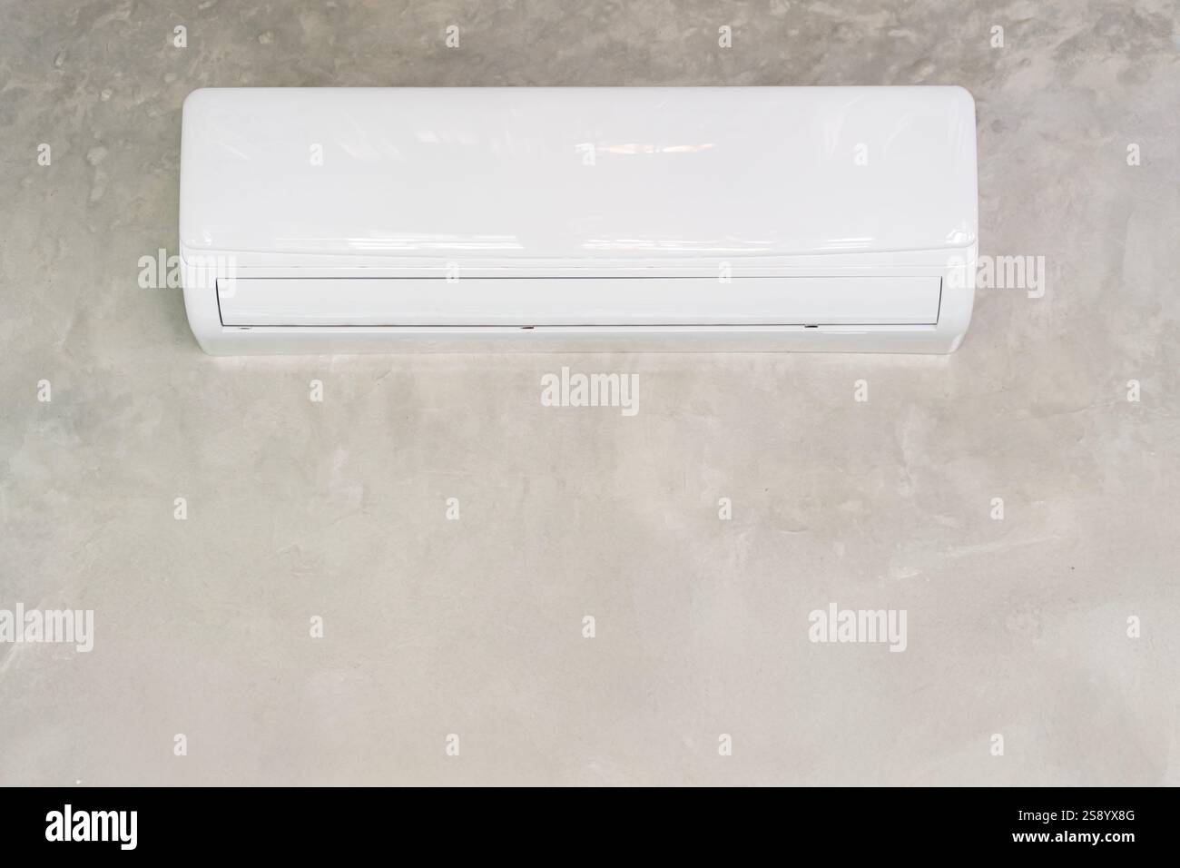 Air conditioner on white wall room interior background. Air conditioner and curtain. Stock Photo