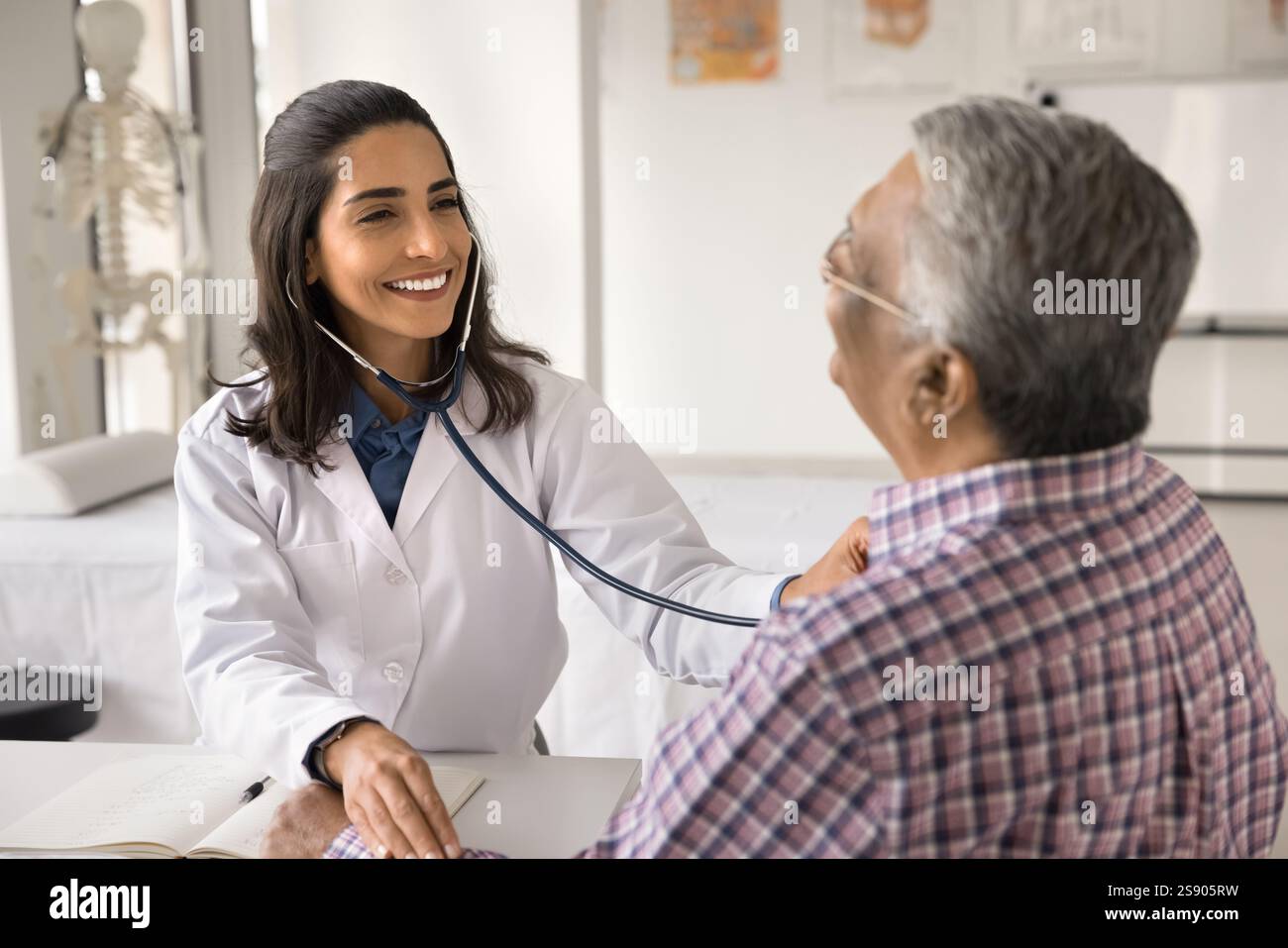 Female doctor check pulse listen to heart of aged patient Stock Photo ...