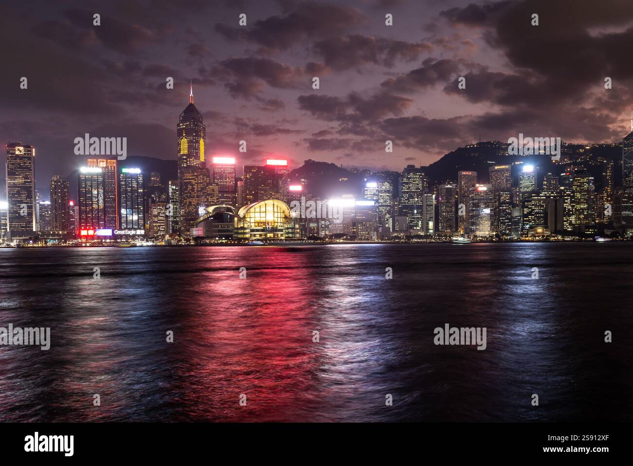 Hong Kong skyline at night viewed from Victoria Harbour Stock Photo - Alamy